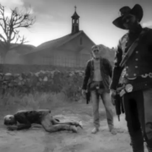A black and white screenshot of a cowboy themed video game showing a person laying on the ground and two people looking at the camera in front of a church