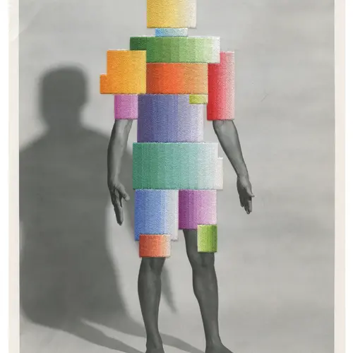 Image of a robot figure, covered in sewn colourful squares