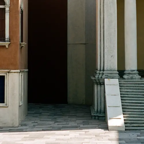 Landscape format colour photograph of two Italian buildings