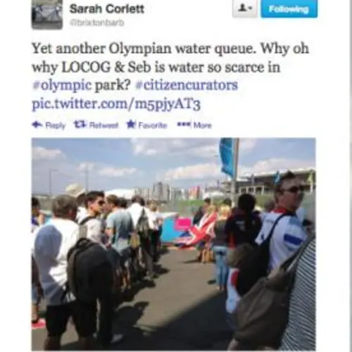 A tweet by Sarah Corlett saying "Yet another Olympian water queue. Why oh why LOCOG  & Seb is water so scarce in #olympic park?  #citizencurators". A photograph of people queuing 