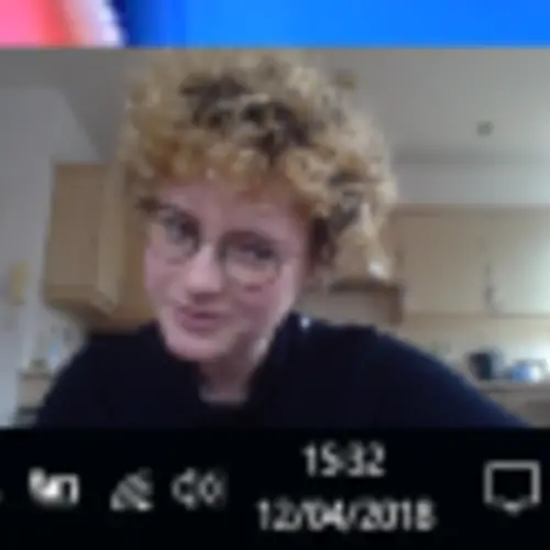 A screenshot of a person on an online video meeting