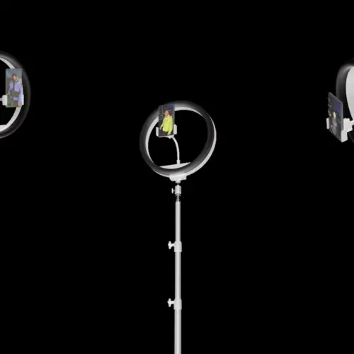 Three ring lights with phones showing portraits inside. The image has a black background