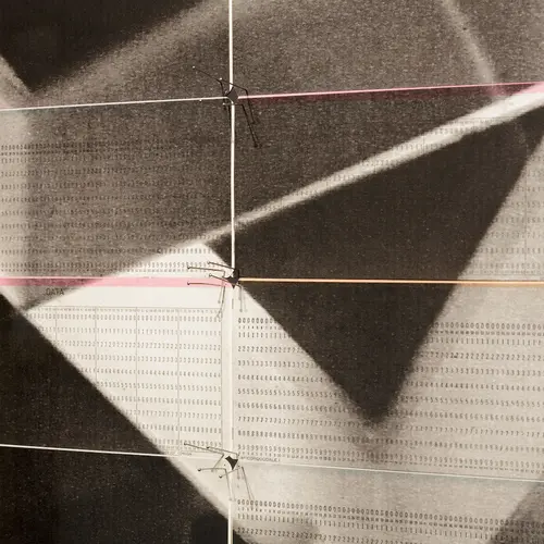 Detail of artwork made up of computer cards printed with black and white abstract shapes.