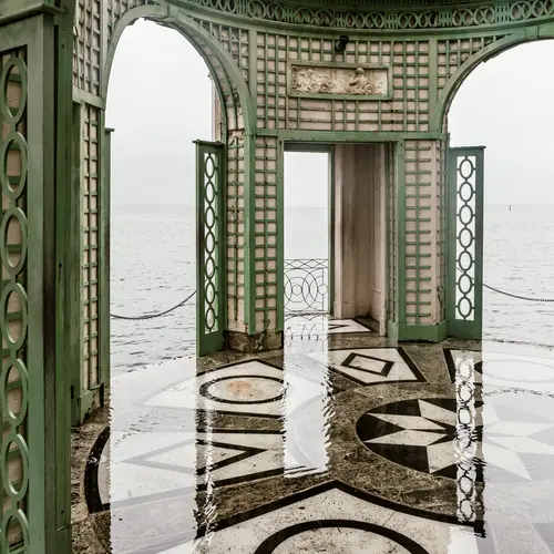 Ornate marble floor and archways with sea view