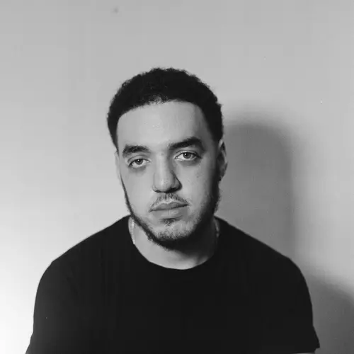 Portrait of poet and photographer in black and white.