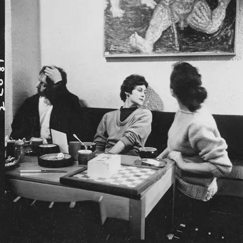 image of women at a table playing chess and discussing at the original partisan coffee house in soho, seen at the photographers gallery