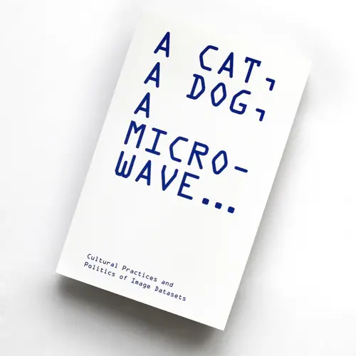 A book with the title 'A Cat, A Dog, A microwave'