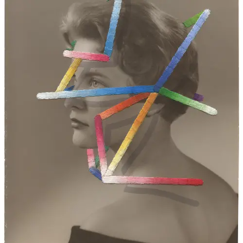 An black and white vintage portrait of a woman with her hair pinned into a neat bun. Her face is partially obscured by multi-coloured 