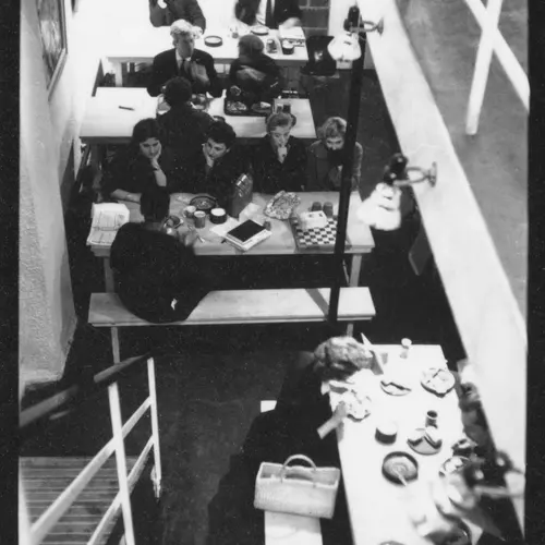 Black and White Photograph, by Roger Mayne, showing an aerial view of tables and seats of The Partisan Coffee House, displayed at The Photographers' Gallery in London
