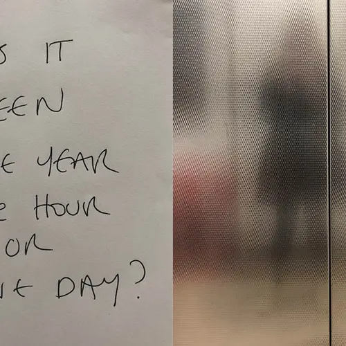 Magazine spread with hand written text on one side and a blurred colour photo of a figure on the other.