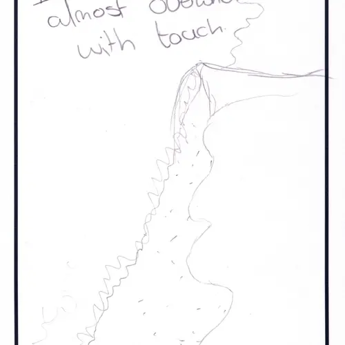 Postcard with writing and abstract drawing.