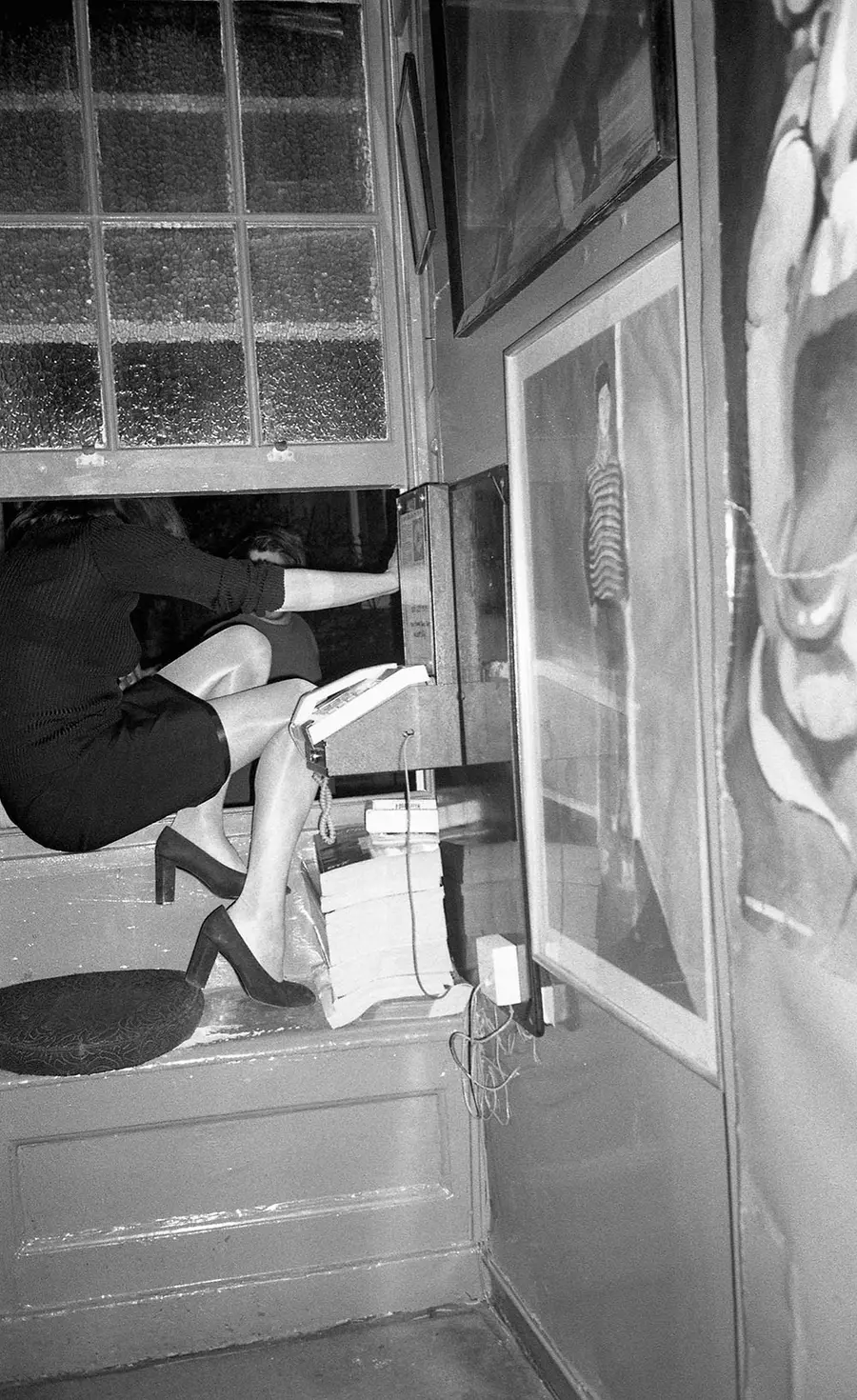 Person climbing out of window.