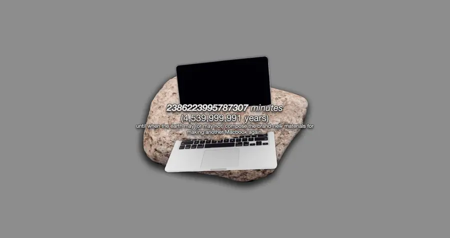 A laptop over a rock with two series of large numbers on top
