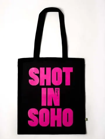 Pink text on black tote