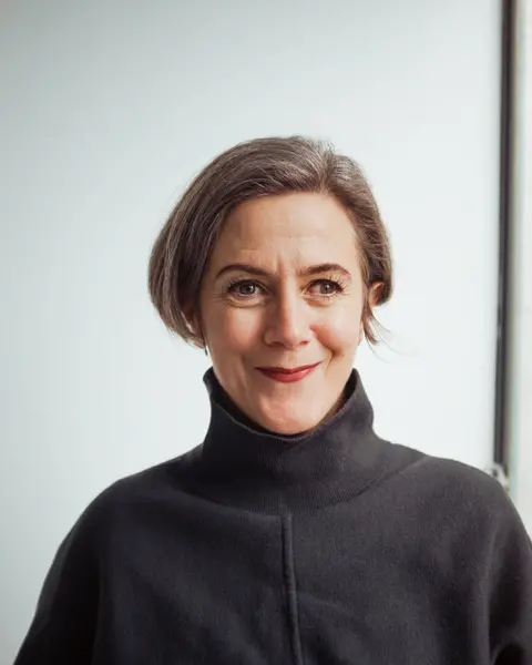 A portait of a person smiling.