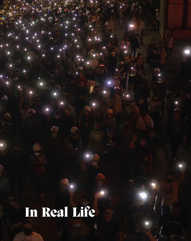 Image of book cover- crowd holding phone torches 