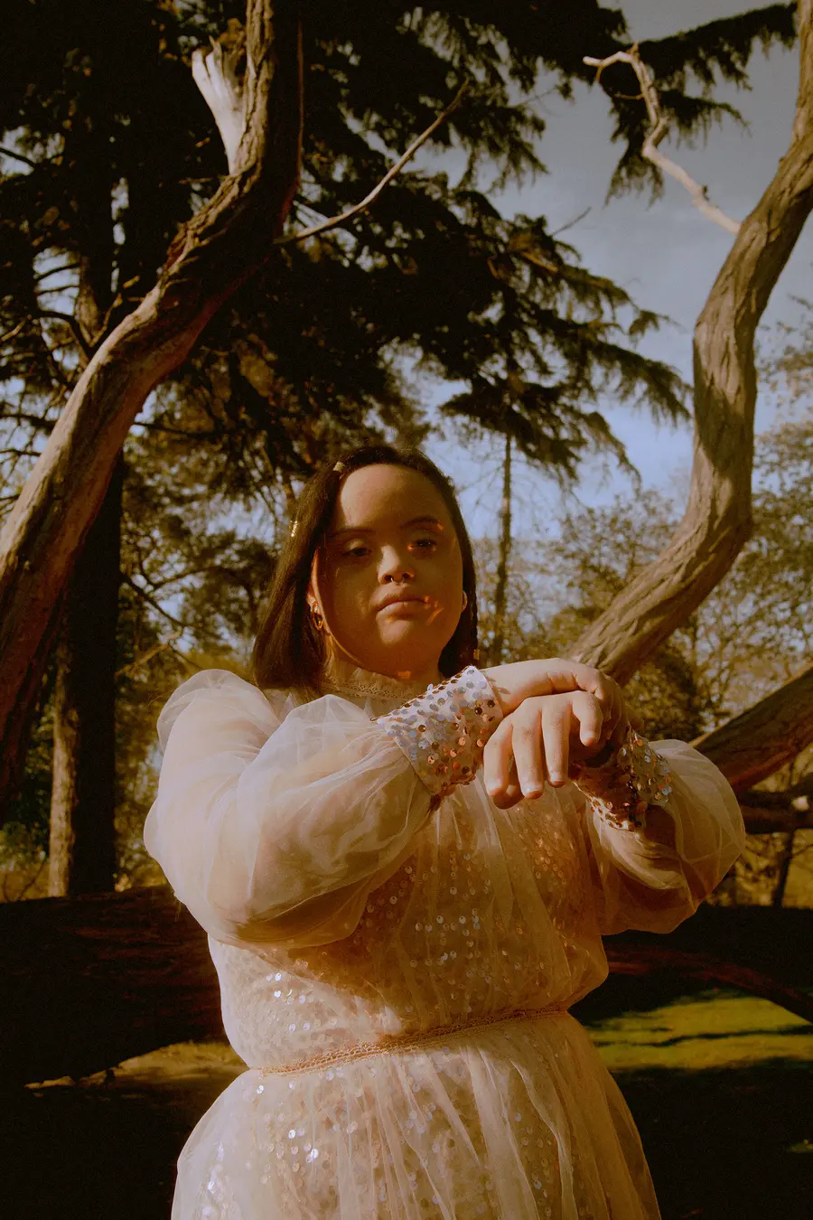 : photograph of a young disabled woman in a pink dress posing for the camera by Anna Neubauer