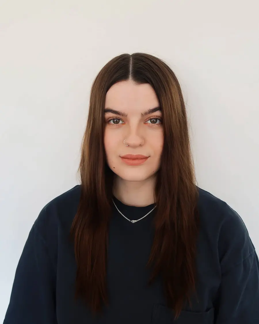 Headshot of woman with long brown hair. 