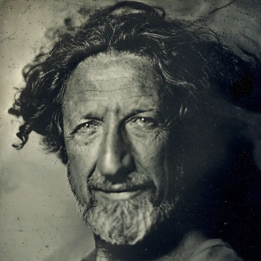 Black and white portrait of Gideon Mendel.