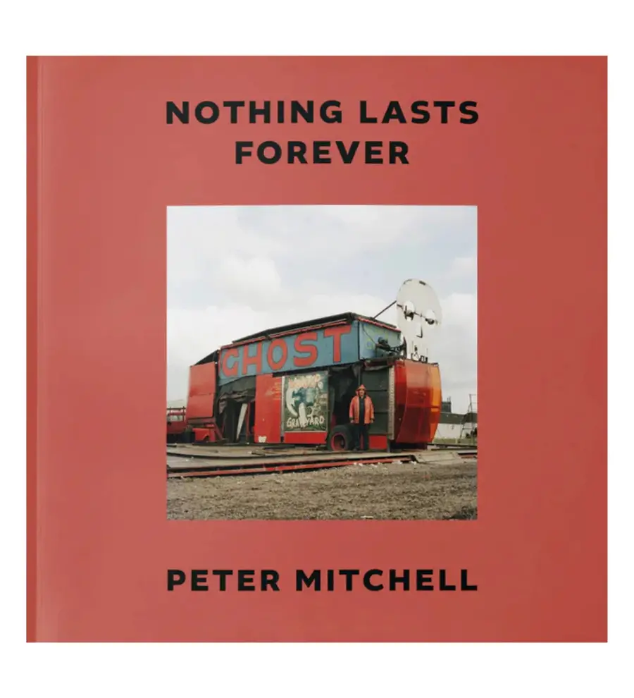 Image of a book cover that features the title 'nothing Lasts Forever' by Peter Mitchell and a colour image of a man in a red coat stood in front of a disused fairground ghost ride.