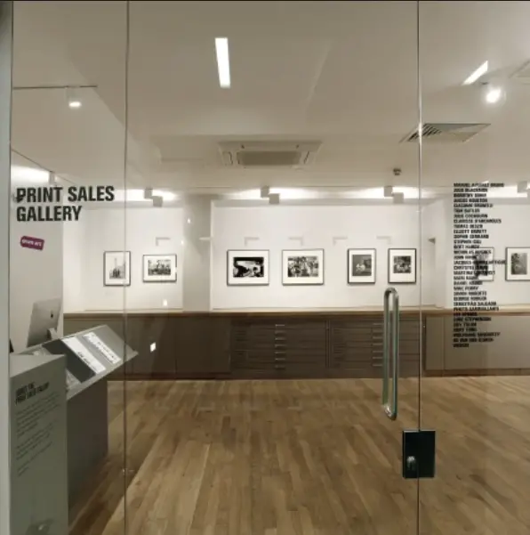 Colour image of a set of glass doors leading into the exhibition space of the Print Sales Gallery.
