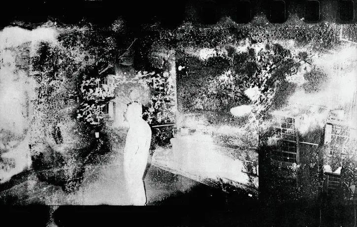 Abstract black and white photograph of a white silhouetted figure among a high contrast backdrop