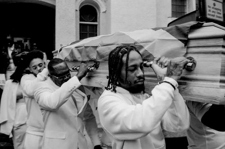 black and white photograph of pallbearers