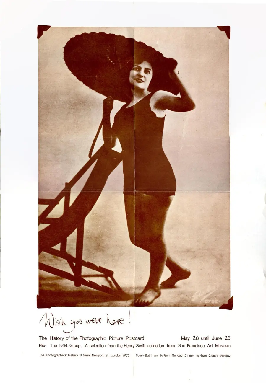 Original exhibition poster showing a woman in a swimming costume with a parasol