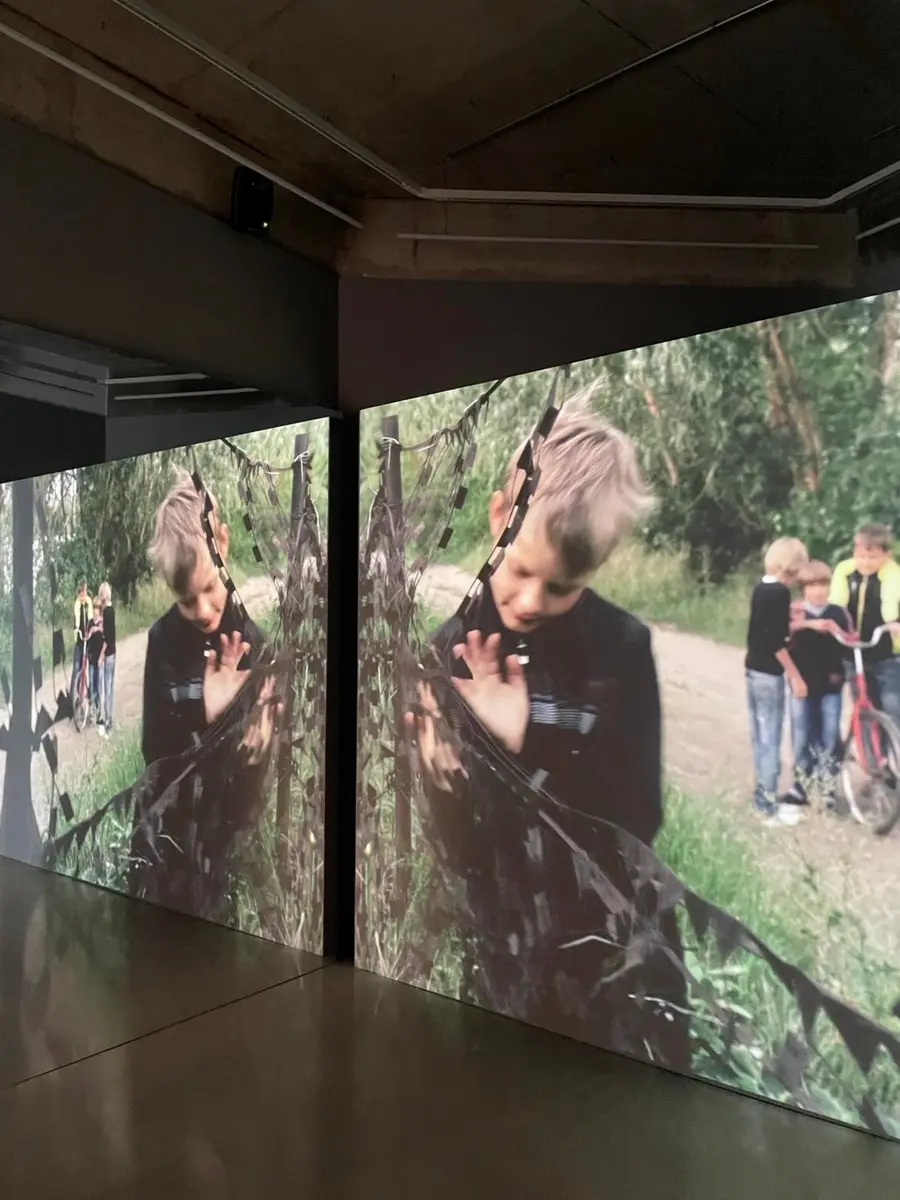 Archival footage of a young boy playing