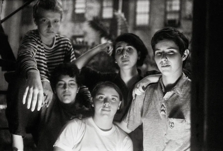 A group of young people gathered on a fire escape