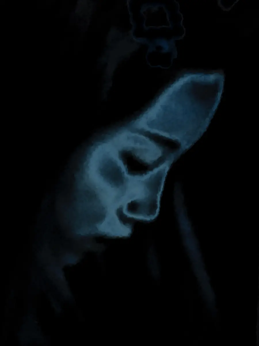 Dark blue close up of a face in profile, looking down.