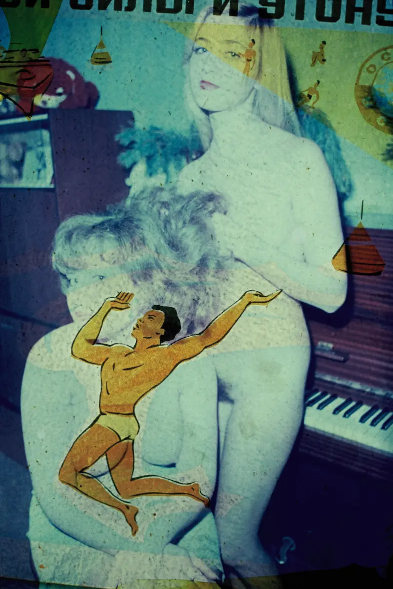 Colour photograph of a naked woman  leaning on a piano whilst holding the hair of another woman  sitting down. An animated image of a partially-naked  muscular man obscures the woman sitting down.