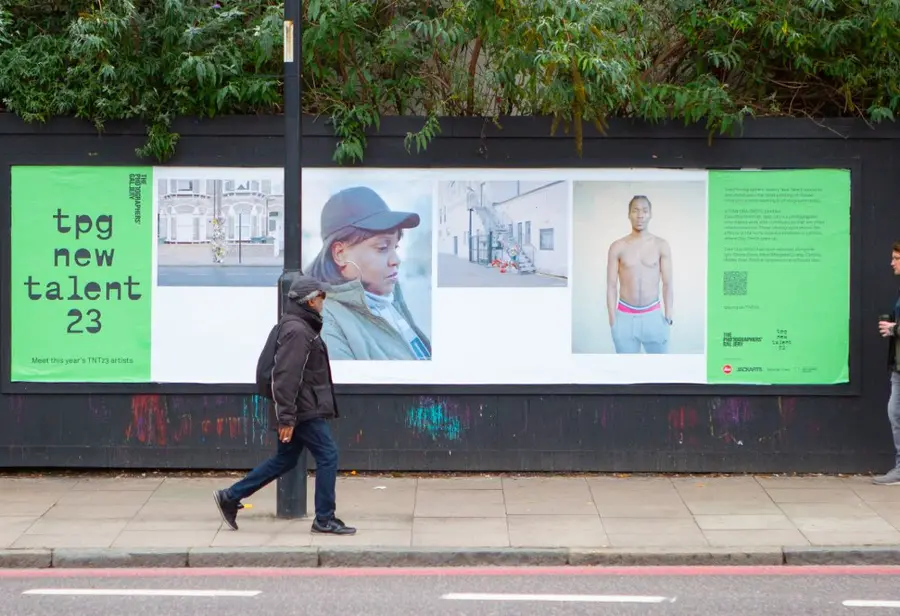 Colour photograph of a billboard with colour images and text 'TPG new talent 23'