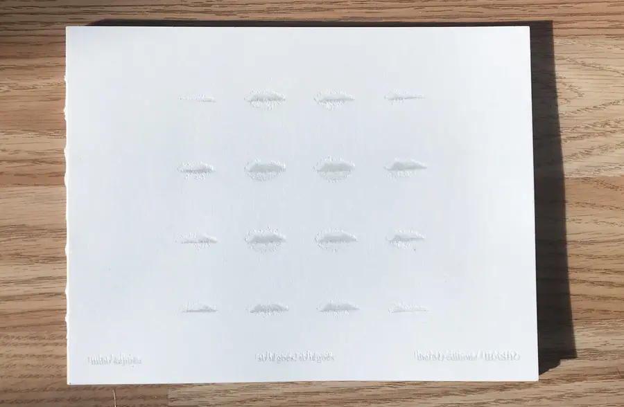 A photograph of a book on a wooden table.