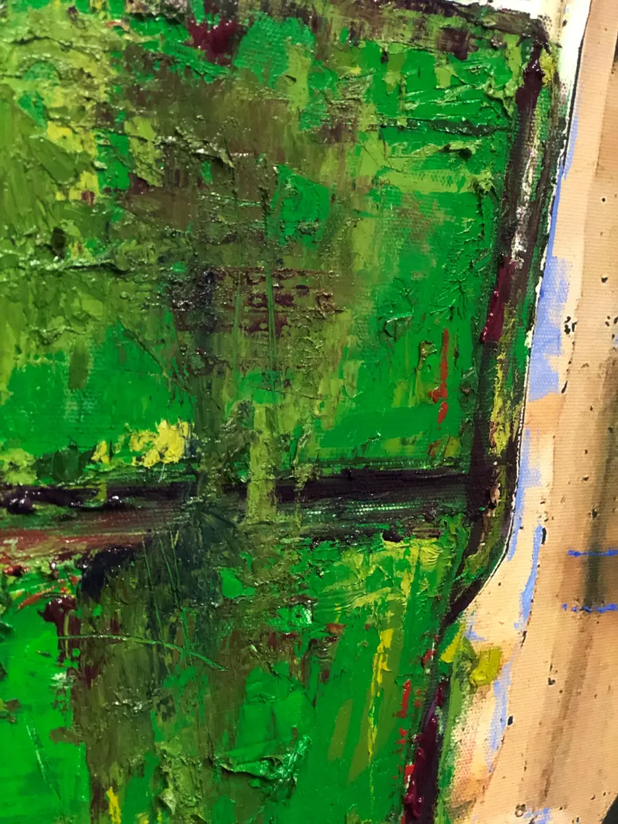 close up of green paint over image 