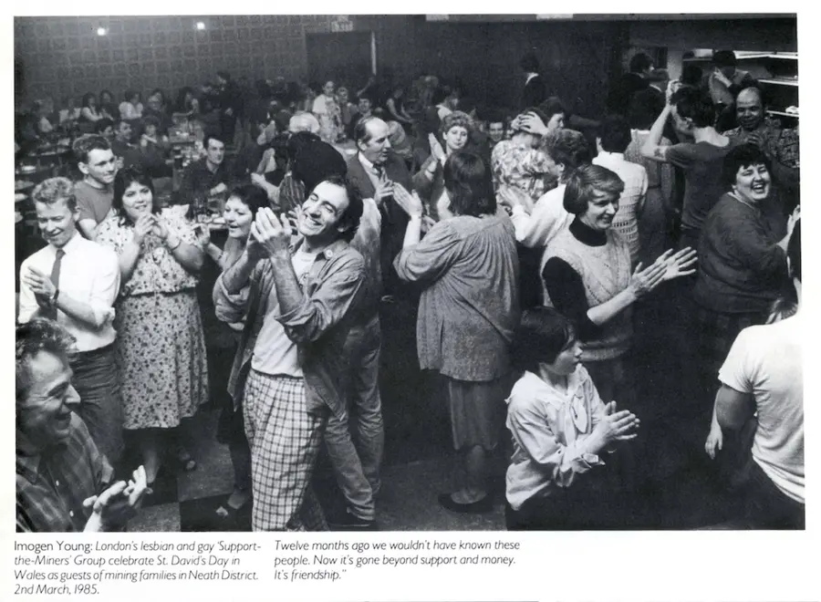 Imogen Young: London's lesbian and gay 'Support-the-Miners' Group celebrate St. David's Day in Wales as guests of mining families in Neath District, 2nd March, 1985.  Image from exhibition leaflet, courtesy The Photographers' Gallery Archive, 1985. 