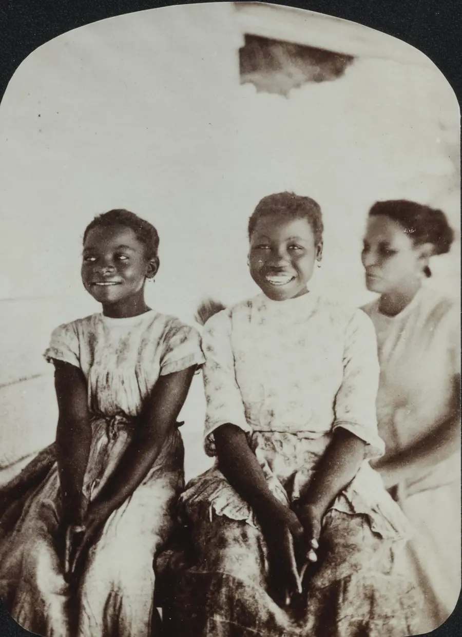 Image of three girls sitting down