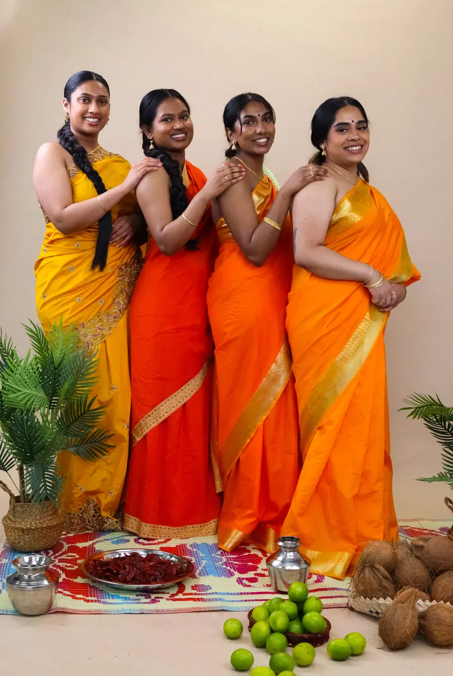 Photograph of group of women in studio wearing traditional Sri Lankan clothing. 