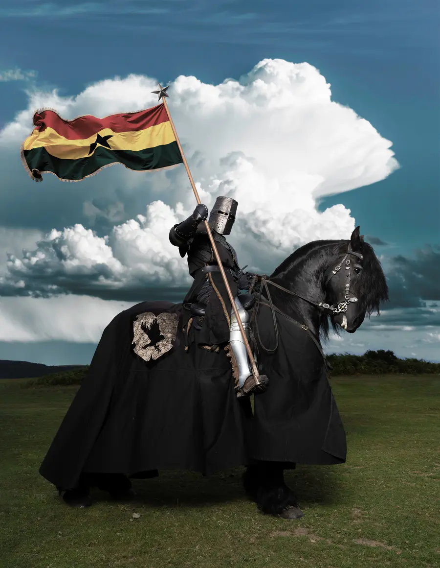 colour photograph of a knight on horseback holding a Ghana flag