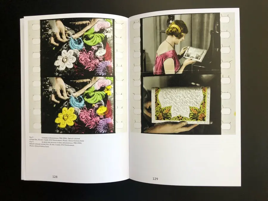 page from book of an old film, manually coloured 