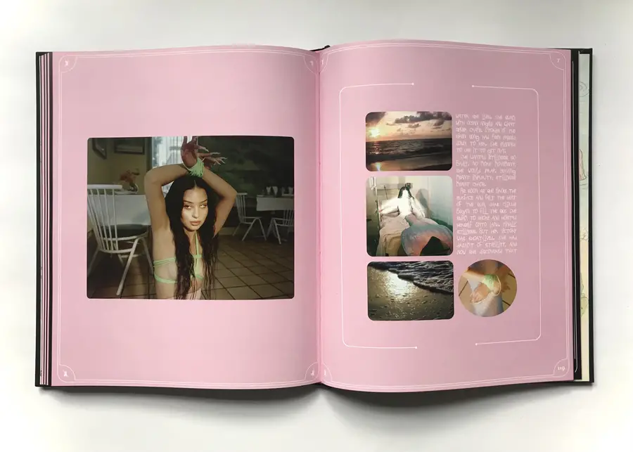Open photo book featuring photographs and text on pink pages.