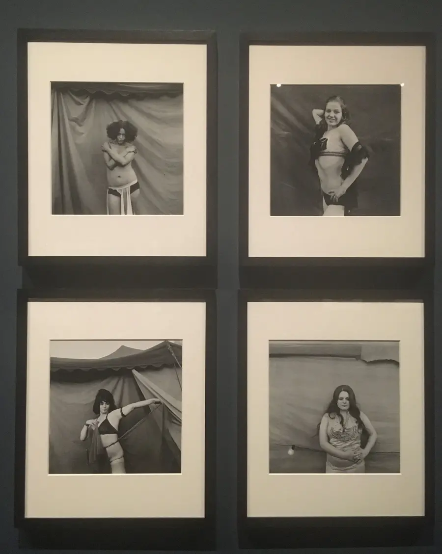 Four framed images of Carnival Strippers