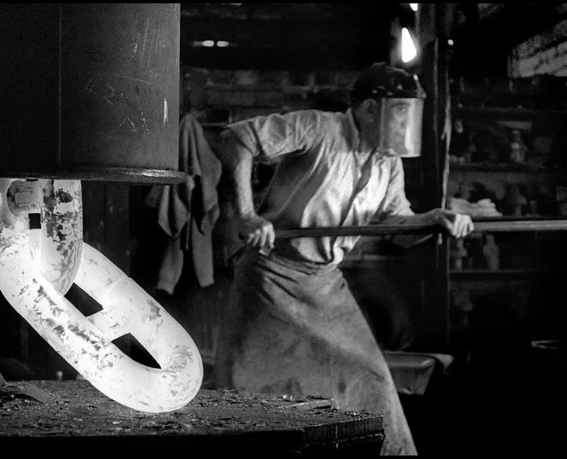 Man working working in an industrial forge 