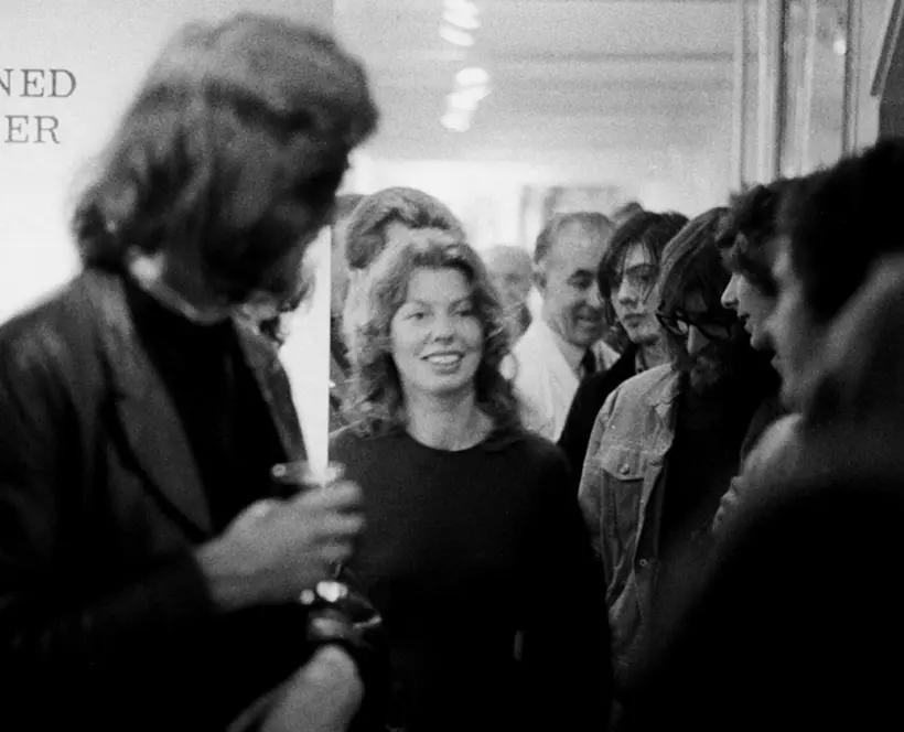 An image from the private view for The Concerned Photographer, the first exhibition at The Photographers' Gallery in 1971. Sue Davies is pictured in the middle of a large crowd. 