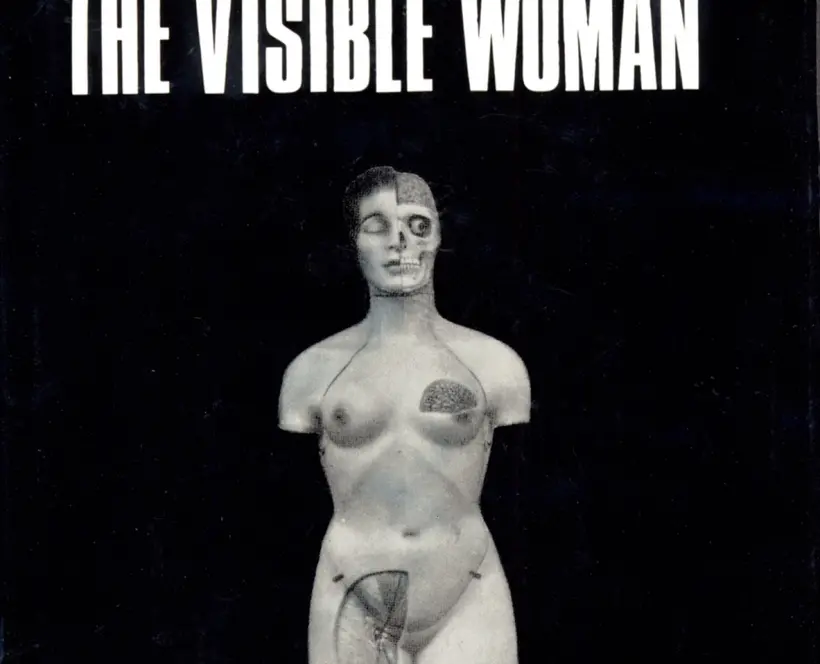 Light skinned mannequin displayed on black book cover. Figure is presented without arms and legs and with portions exposing more anatomical representation