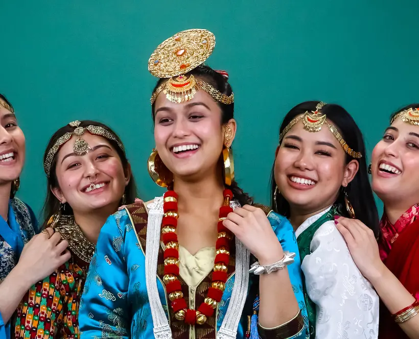 Photograph of a group of women wearing traditional Nepalese clothing and accessories.