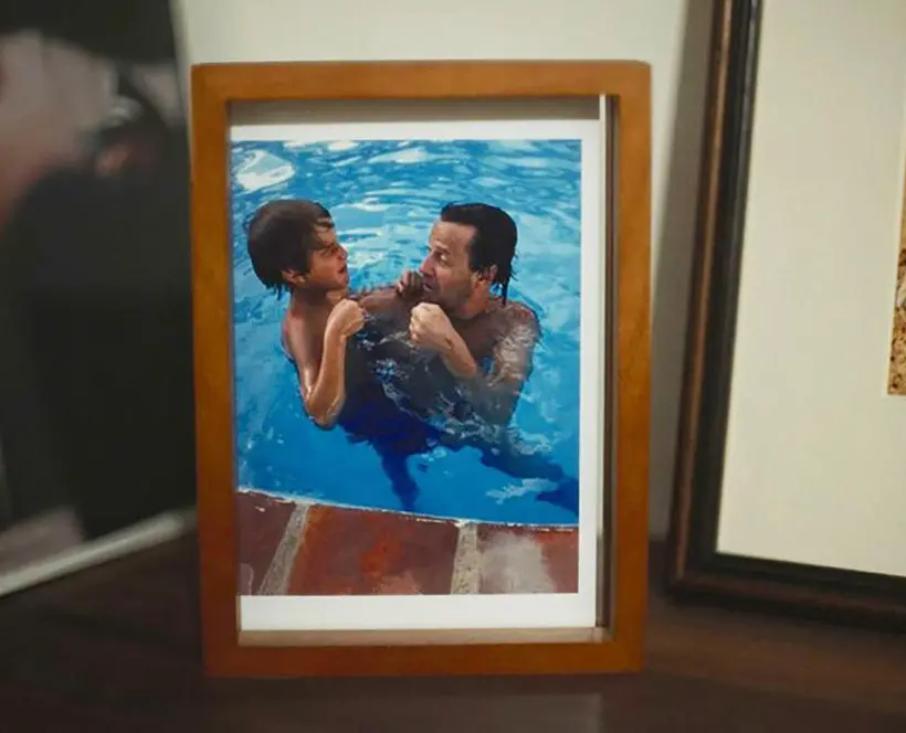A father and child go swimming